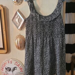 LOFT Black and White Sleeveless Ruffle Blouse with elastic bodice; flowing tunic